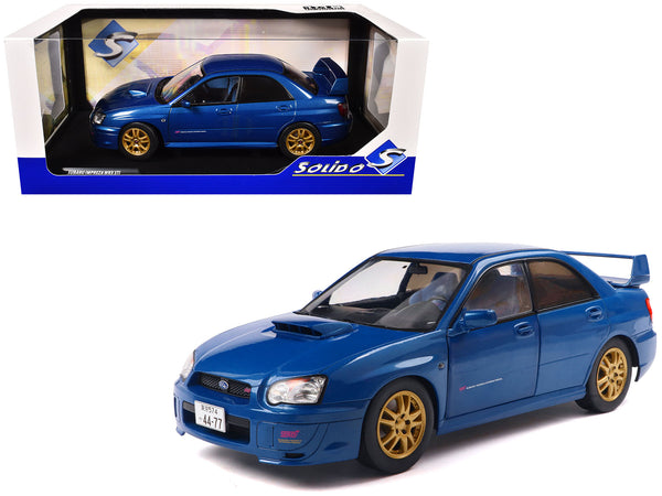 2003 Subaru Impreza WRX STI RHD (Right Hand Drive) Sonic Blue Metallic with Gold Wheels 1/18 Diecast Model Car by Solido