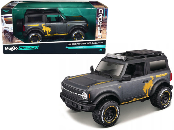 2021 Ford Bronco Badlands Dark Gray Metallic with Gold Graphics and Roof Rack "Off-Road" "Maisto Design" Series 1/24 Diecast Model by Maisto