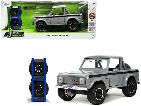 1973 Ford Bronco Pickup Truck Gray with Black Stripes with Extra Wheels Just Trucks" Series 1/24 Diecast Model by Jada