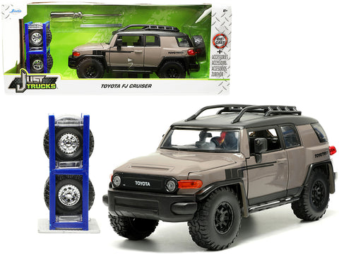 Toyota FJ Cruiser with Roof Rack Brown and Black "Toyo Tires" with Extra Wheels "Just Trucks" Series 1/24 Diecast Model by Jada